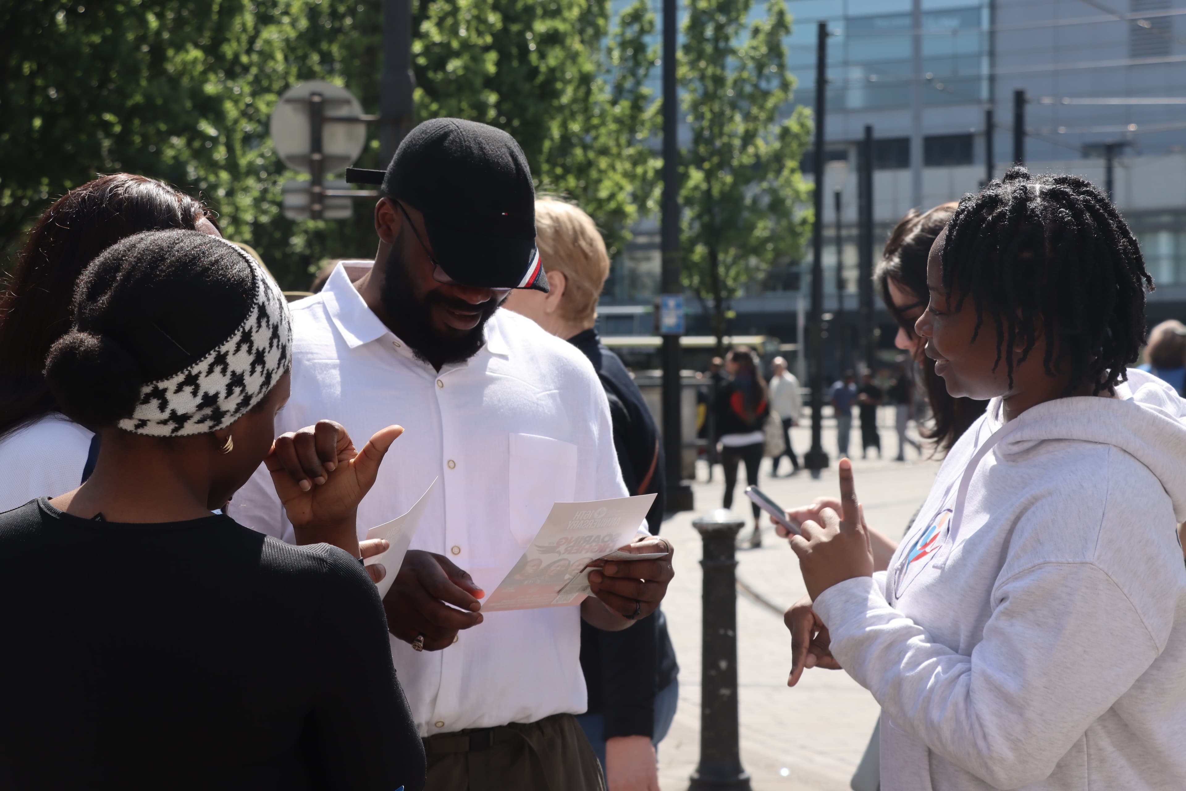 Church members talking with people in the city centre during outreach